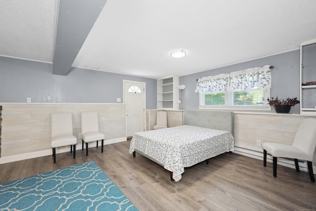 69 Sills Dr, Watertown, CT 06779 - bedroom featuring wood finished floors and wainscoting