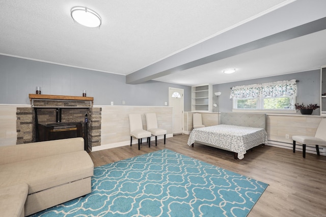 69 Sills Dr, Watertown, CT 06779 - bedroom featuring wood finished floors, crown molding, and a textured ceiling