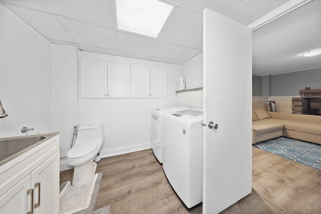 69 Sills Dr, Watertown, CT 06779 - laundry room featuring separate washer and dryer and light wood-style floors