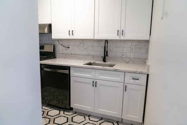 5 Melon Ln Unit 5, Ridgefield, CT 06877 - kitchen featuring dishwasher, wall chimney exhaust hood, white cabinets, decorative backsplash, and light stone counters