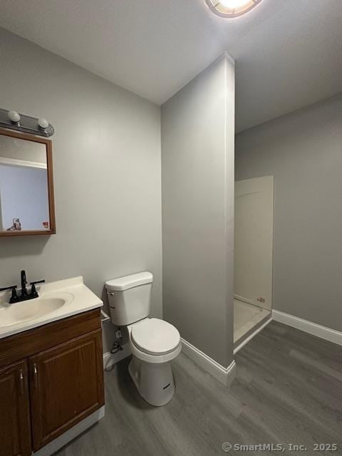 473 E Main St, Waterbury, CT 06702 - bathroom with wood finished floors, vanity, and a shower