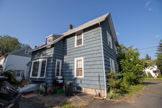 47 Ridge Rd, Middletown, CT 06457 - view of property exterior with a chimney