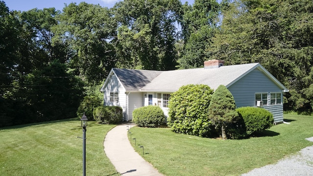 19 Eli Chapman Rd, East Haddam, CT 06469 - view of side of home with a lawn, a chimney, and a shingled roof