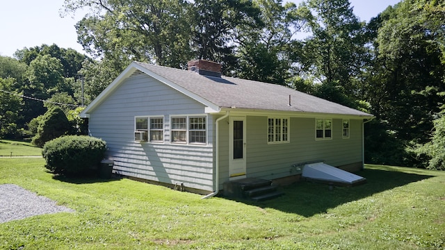 19 Eli Chapman Rd, East Haddam, CT 06469 - view of side of property with a chimney, a lawn, and a shingled roof