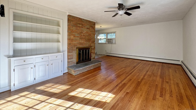 19 Eli Chapman Rd, East Haddam, CT 06469 - unfurnished living room with ceiling fan, light wood finished floors, a baseboard radiator, a fireplace, and cooling unit