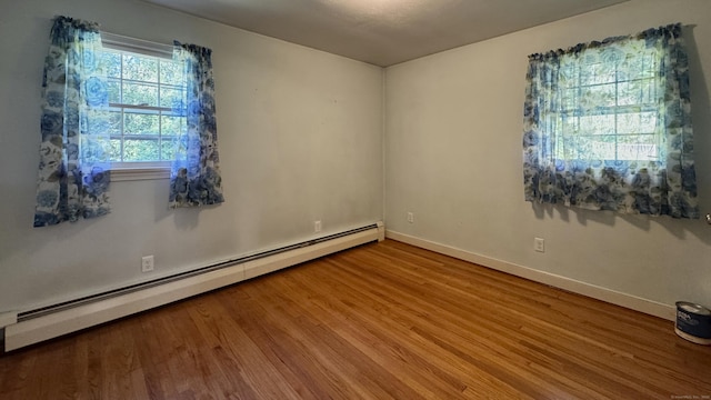19 Eli Chapman Rd, East Haddam, CT 06469 - empty room featuring a baseboard heating unit and wood finished floors