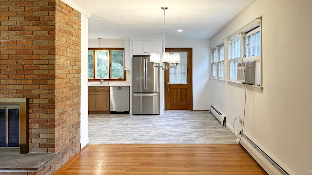 19 Eli Chapman Rd, East Haddam, CT 06469 - kitchen with stainless steel appliances, baseboard heating, a chandelier, healthy amount of natural light, and recessed lighting