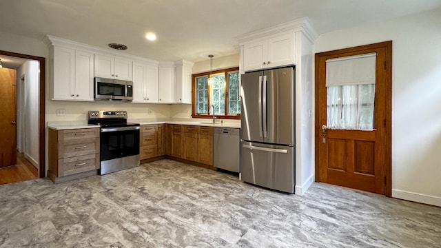 19 Eli Chapman Rd, East Haddam, CT 06469 - kitchen featuring appliances with stainless steel finishes, white cabinetry, light countertops, and pendant lighting