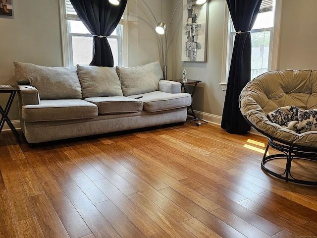 27 White Rose Ave, Waterbury, CT 06708 - living room featuring wood-type flooring and baseboards