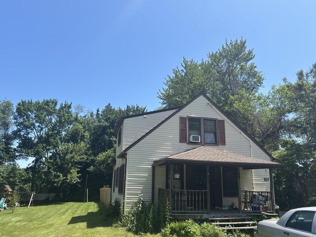 443 Todd Rd, Wolcott, CT 06716 - view of front of house featuring covered porch, a front lawn, roof with shingles, and a playground