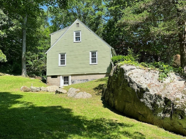 87 Mcveagh Rd, Westbrook, CT 06498 - view of home's exterior featuring a lawn