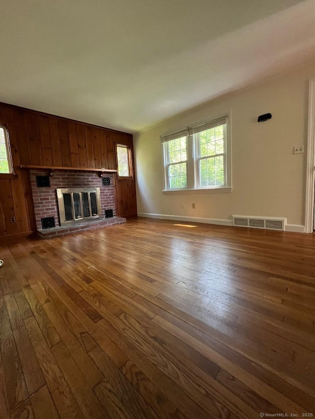 87 Mcveagh Rd, Westbrook, CT 06498 - unfurnished living room featuring hardwood / wood-style flooring and a fireplace