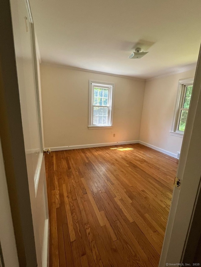 87 Mcveagh Rd, Westbrook, CT 06498 - empty room featuring wood-type flooring and crown molding