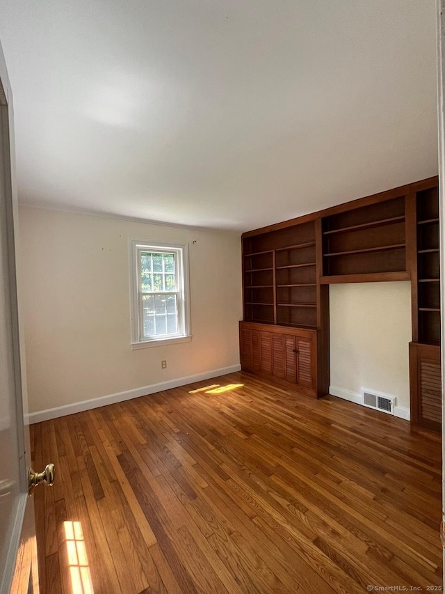 87 Mcveagh Rd, Westbrook, CT 06498 - unfurnished bedroom with wood-type flooring and baseboards