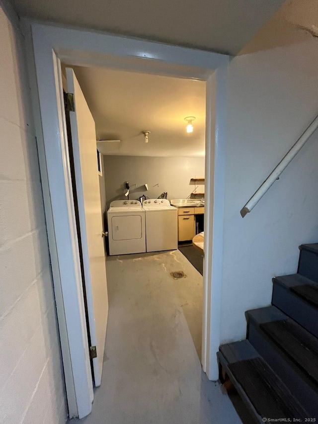 87 Mcveagh Rd, Westbrook, CT 06498 - interior space featuring concrete flooring, washer and dryer, and stairway