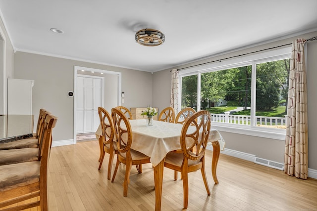 33 Woodside Rd, Guilford, CT 06437 - dining space with light wood finished floors and crown molding