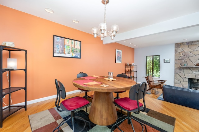 4 Coppergate Rd, East Granby, CT 06026 - dining area with light wood finished floors, a stone fireplace, a chandelier, and recessed lighting