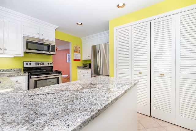 4 Coppergate Rd, East Granby, CT 06026 - kitchen with stainless steel appliances, white cabinets, light stone counters, and recessed lighting