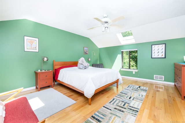 4 Coppergate Rd, East Granby, CT 06026 - bedroom with a skylight, vaulted ceiling, wood finished floors, and a ceiling fan