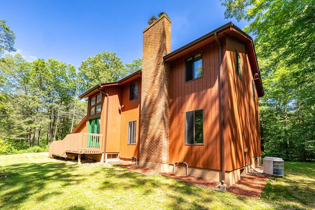 4 Coppergate Rd, East Granby, CT 06026 - rear view of property featuring a chimney and a lawn