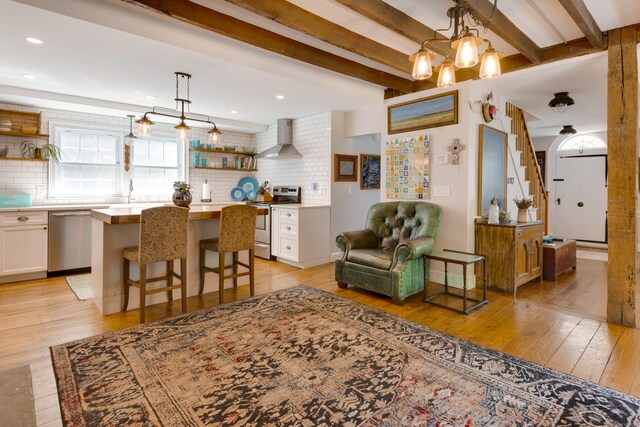 51 Moodus Leesville Rd, East Haddam, CT 06469 - living room with light wood-style flooring, beam ceiling, and recessed lighting