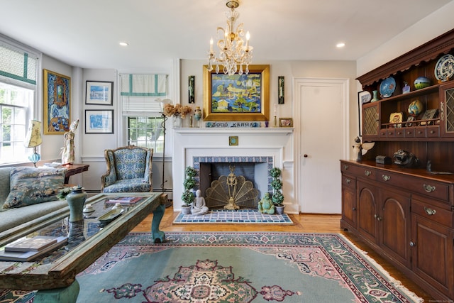 51 Moodus Leesville Rd, East Haddam, CT 06469 - living room featuring light wood-style flooring, a fireplace, plenty of natural light, a chandelier, and recessed lighting