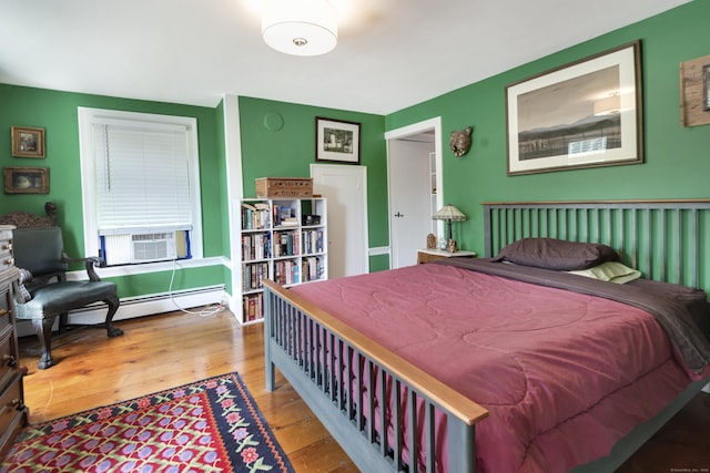 51 Moodus Leesville Rd, East Haddam, CT 06469 - bedroom with a baseboard heating unit, hardwood / wood-style floors, and cooling unit