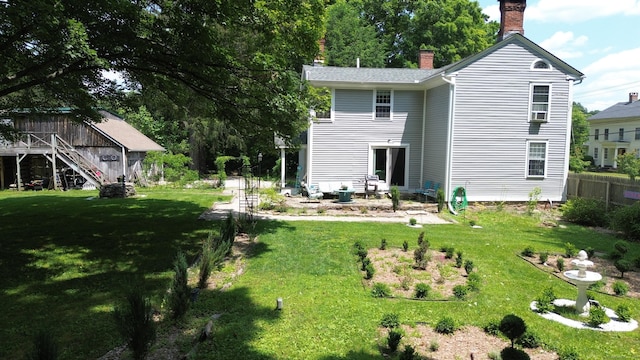 51 Moodus Leesville Rd, East Haddam, CT 06469 - back of property with a chimney and stairs