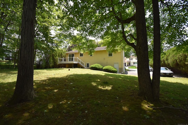 81 Birchwood Dr, Torrington, CT 06790 - view of grassy yard featuring a deck and stairway
