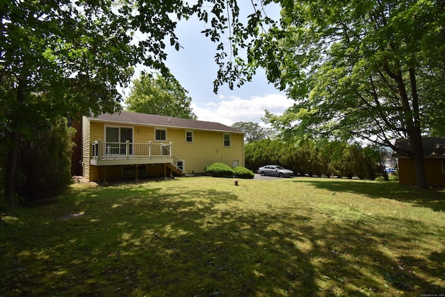 81 Birchwood Dr, Torrington, CT 06790 - back of property with a deck, stairs, and a lawn