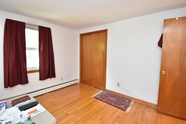 81 Birchwood Dr, Torrington, CT 06790 - entrance foyer featuring wood finished floors and a baseboard heating unit
