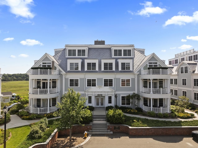 66 High St Unit 31, Guilford, CT 06437 - view of front of property with french doors, a shingled roof, and a balcony