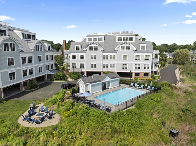 66 High St Unit 31, Guilford, CT 06437 - community pool with a fire pit, a patio, and an outbuilding