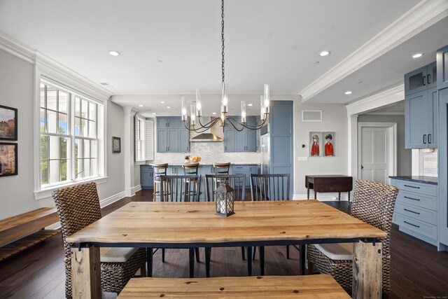 66 High St Unit 31, Guilford, CT 06437 - dining space featuring a chandelier, dark wood-type flooring, recessed lighting, and crown molding