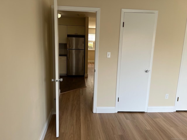 29 Van Buren Ave Unit J4, Norwalk, CT 06850 - unfurnished bedroom featuring freestanding refrigerator and light wood finished floors