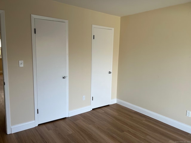29 Van Buren Ave Unit J4, Norwalk, CT 06850 - unfurnished bedroom featuring dark wood-style flooring and baseboards