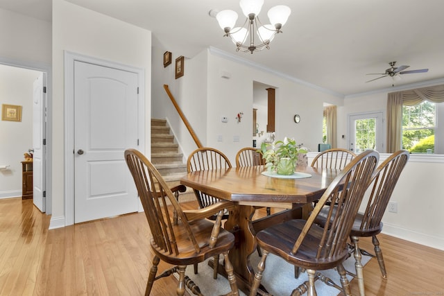 12 Sampson Ter Unit 12, Danbury, CT 06810 - dining room featuring light wood finished floors, a chandelier, stairway, a ceiling fan, and crown molding