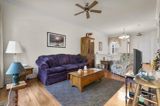 12 Sampson Ter Unit 12, Danbury, CT 06810 - living area featuring light wood-style flooring, ceiling fan, a chandelier, and crown molding