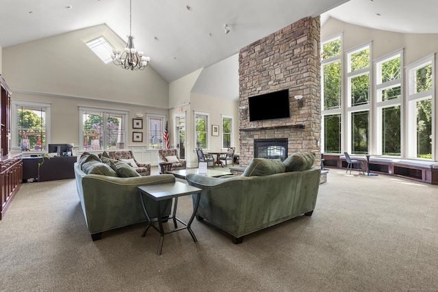 12 Sampson Ter Unit 12, Danbury, CT 06810 - carpeted living area with high vaulted ceiling, a fireplace, and a chandelier