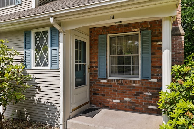 13 Waterview Dr, Windsor, CT 06095 - property entrance featuring brick siding and a shingled roof