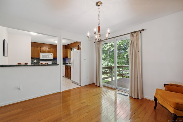 13 Waterview Dr, Windsor, CT 06095 - living area featuring a chandelier and light wood-style flooring