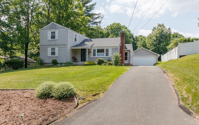 49 Remington Rd, Windsor, CT 06095 - view of front of home with a chimney, a garage, and an outbuilding