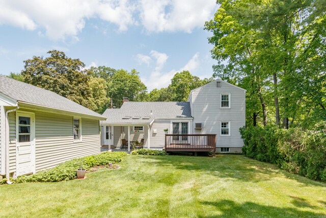 49 Remington Rd, Windsor, CT 06095 - back of property featuring a deck, a lawn, and a shingled roof