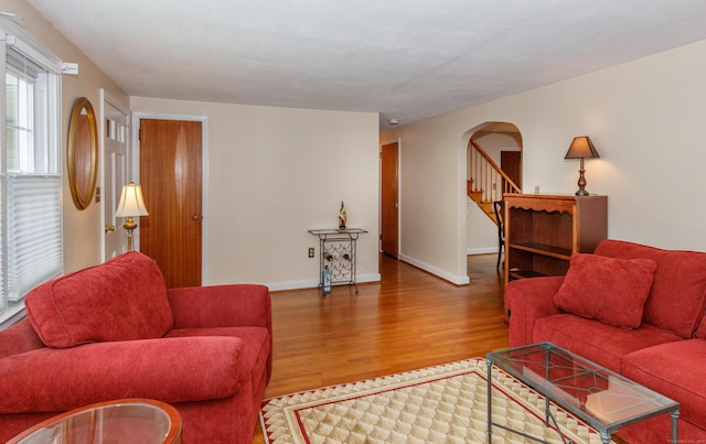 49 Remington Rd, Windsor, CT 06095 - living area with wood finished floors, arched walkways, and stairway