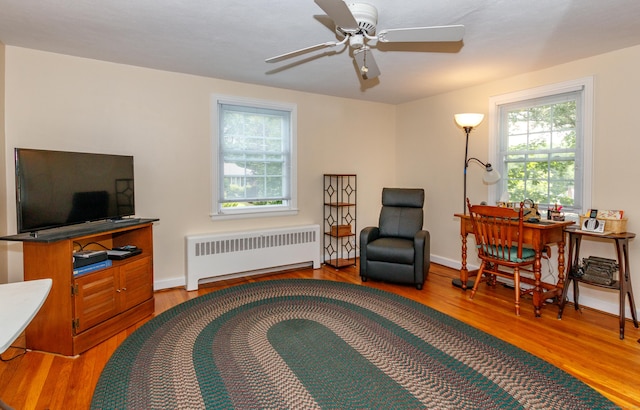 49 Remington Rd, Windsor, CT 06095 - living area with radiator heating unit, wood finished floors, and ceiling fan
