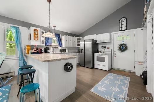 27 Laurelwood Dr, East Lyme, CT 06357 - kitchen with stainless steel refrigerator with ice dispenser, white electric range oven, a peninsula, white cabinets, and pendant lighting
