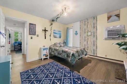 27 Laurelwood Dr, East Lyme, CT 06357 - bedroom featuring baseboard heating and wood finished floors