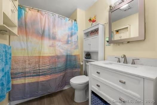 27 Laurelwood Dr, East Lyme, CT 06357 - bathroom featuring wood finished floors, vanity, and shower / bath combination with curtain