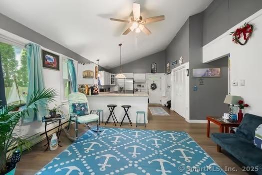 27 Laurelwood Dr, East Lyme, CT 06357 - living room with ceiling fan, vaulted ceiling, and wood finished floors