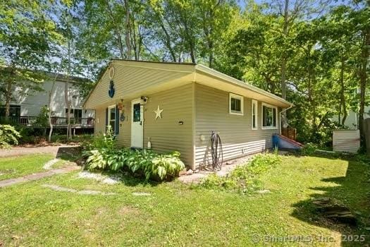 27 Laurelwood Dr, East Lyme, CT 06357 - view of side of home with a yard and a deck
